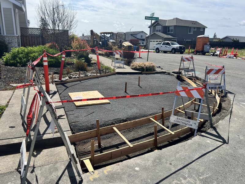 Creating the forms before pouring the concrete for a new pedestrian curb ramp